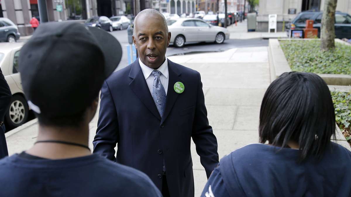  May 8, 2014 mayoral candidate Eric Jackson greets a couple in downtown Trenton.  (AP File Photo/Mel Evans) 