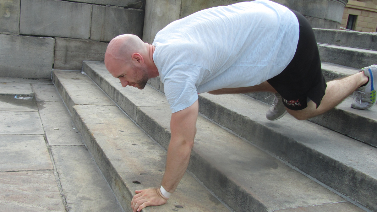  Gabe Arnold is raising money for Halo Trust, which works to clear landmines from war-torn areas around the globe. He'll spend Saturday morning crawling between the Philadelphia Museum of Art and City Hall to generate awareness for the cause. (Aaron Moselle/WHYY) 