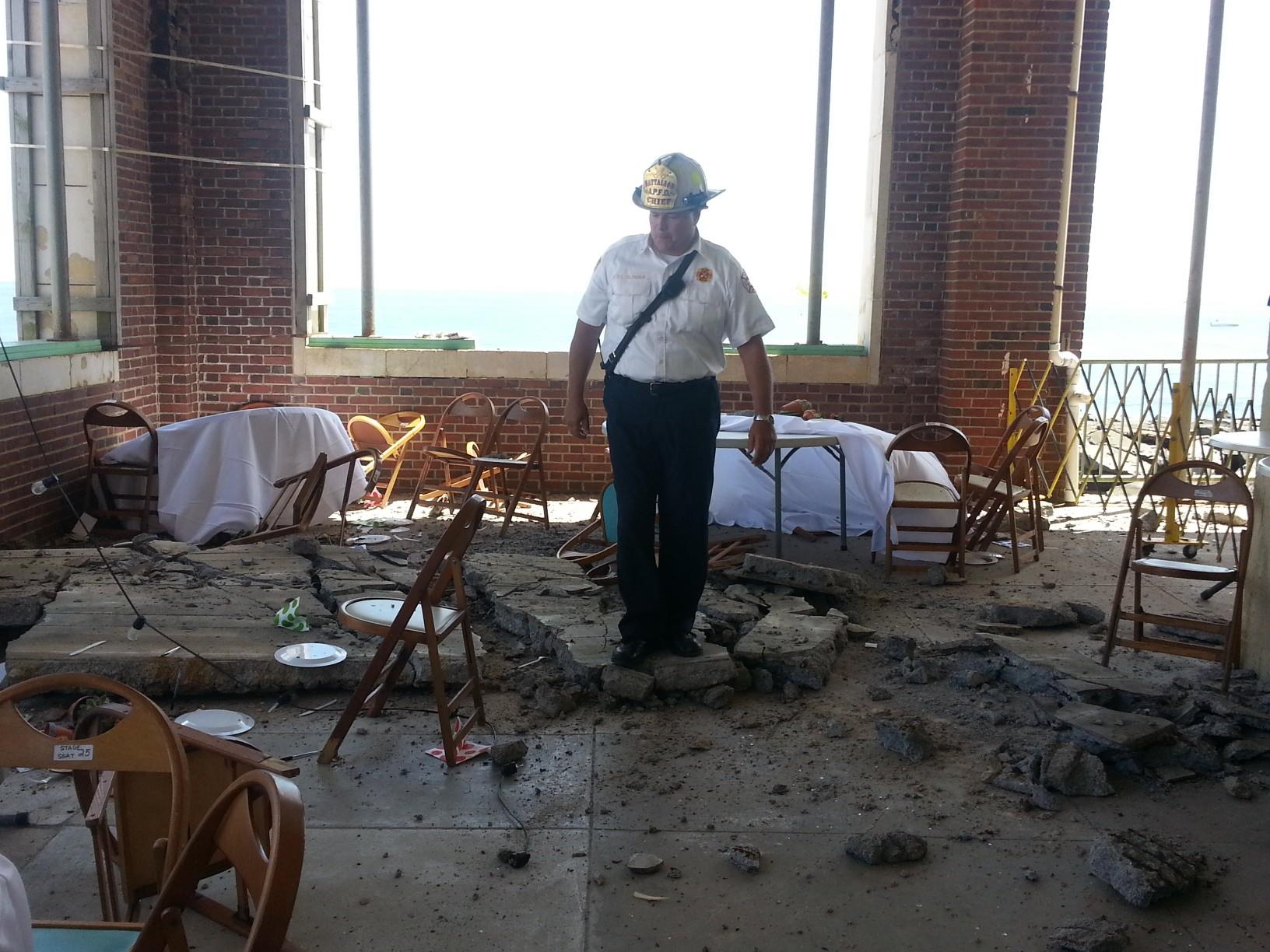  An Asbury Park firefighter stands on a portion of the collapsed concrete slab. (Photo: Asbury Park Fire Department) 