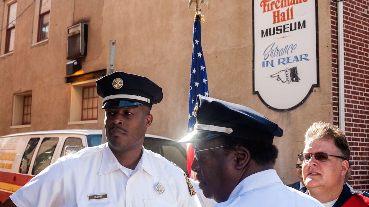 Members of the Philadelphia Fire Department stand outside of the Fireman's Hall Museum on the 15th anniversary of the September 11th attacks on the World Trade Center.