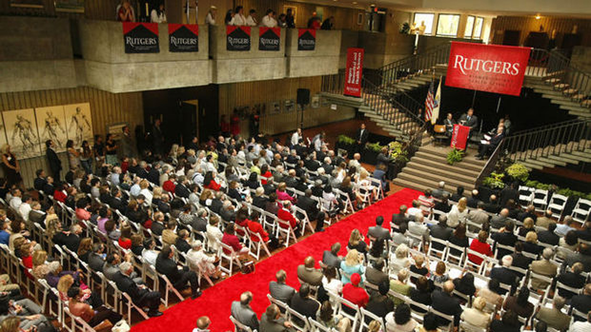  New banners are unfurled during a Rutgers ceremony to mark Rutgers University's takeover of most of the University of Medicine and Dentistry of New Jersey. Patti Sapone/ The Star-Ledger 