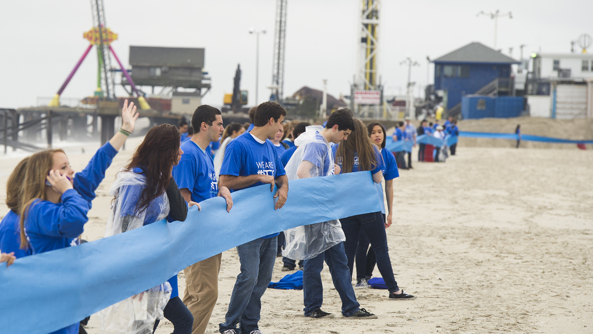  A record breaking five mile long ribbon stretches along the beach linking some of the shore towns that were hardest hit by Superstorm Sandy, on Friday, May 24, 2013 in Seaside Heights, N.J. (Photo by Charles Sykes/Invision/AP) 