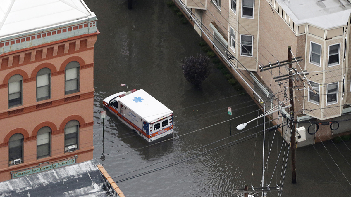 An ambulance drives through a flooded street in Hoboken, N.J. in the wake of Superstorm Sandy on Tuesday, Oct. 30, 2012. (Mike Groll/AP Photo) 