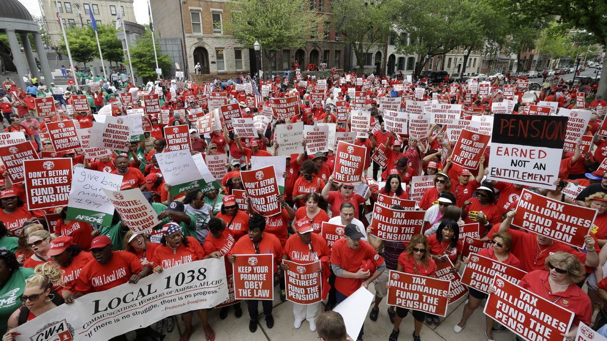  A large crowd of mostly public employee union members fill the plaza and street in front of the Statehouse Tuesday, May 12, 2015, in Trenton, N.J. The unions are protesting of Gov. Chris Christie's pension funding reductions. (AP Photo/Mel Evans) 