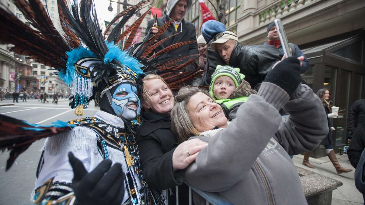 Linda Sellers of Northeast Philadelphia takes a selfie of herself, her daughter Julie Sellers, her grandson Lucas Sellers, 2, with a member of the Franlinger String Band after the band’s performance. (Jonathan Wilson/for NewsWorks)