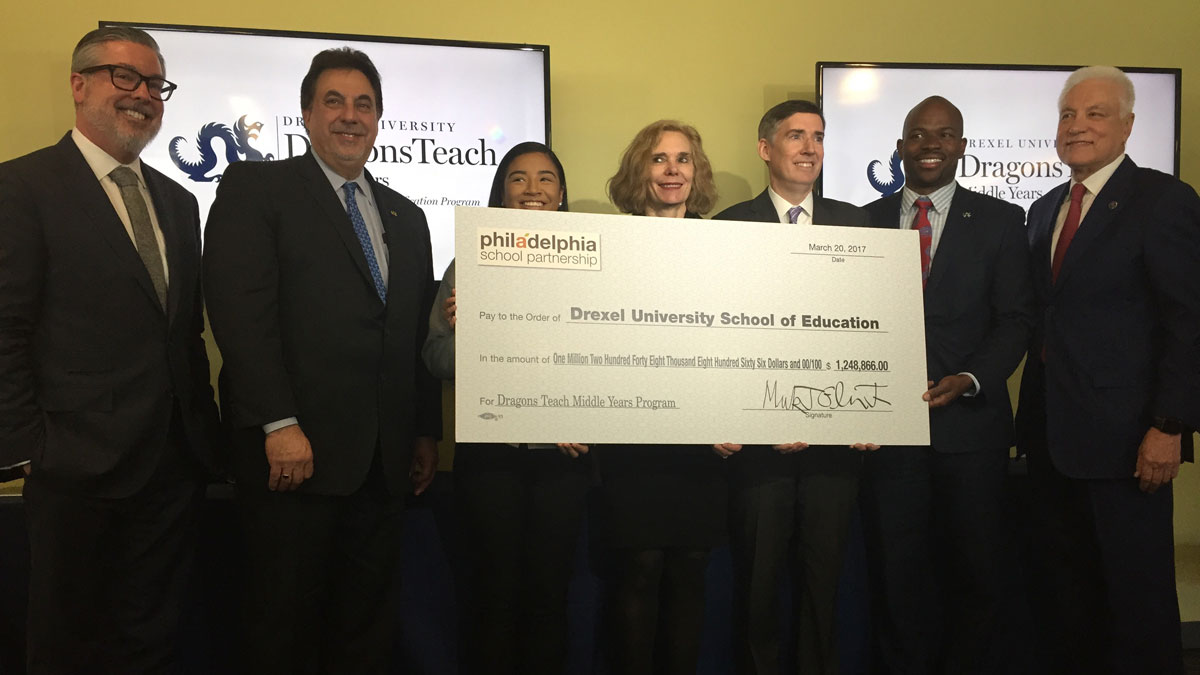  Representatives from Drexel and Philadelphia School Partnership celebrate the launch of Dragons Teach Middle Years (Avi Wolfman-Arent/WHYY) 