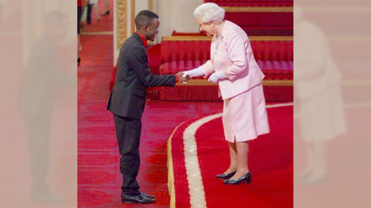  Queen Elizabeth greets Brighton Kaoma. (Provided) 