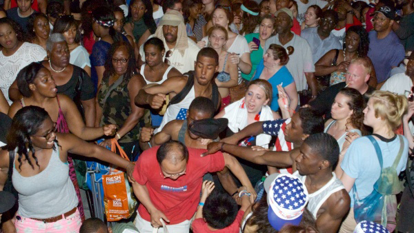  People are seen in the audience reacting aggressively toward a what seems to be a tourist family. (Bas Slabbers/for NewsWorks) 