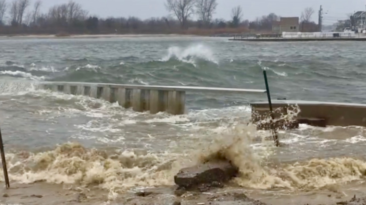  Water entering through a hole in the Manasquan River bulkhead in Point Pleasant Beacb on Tuesday. (Image: Michele Lane via JSHN) 