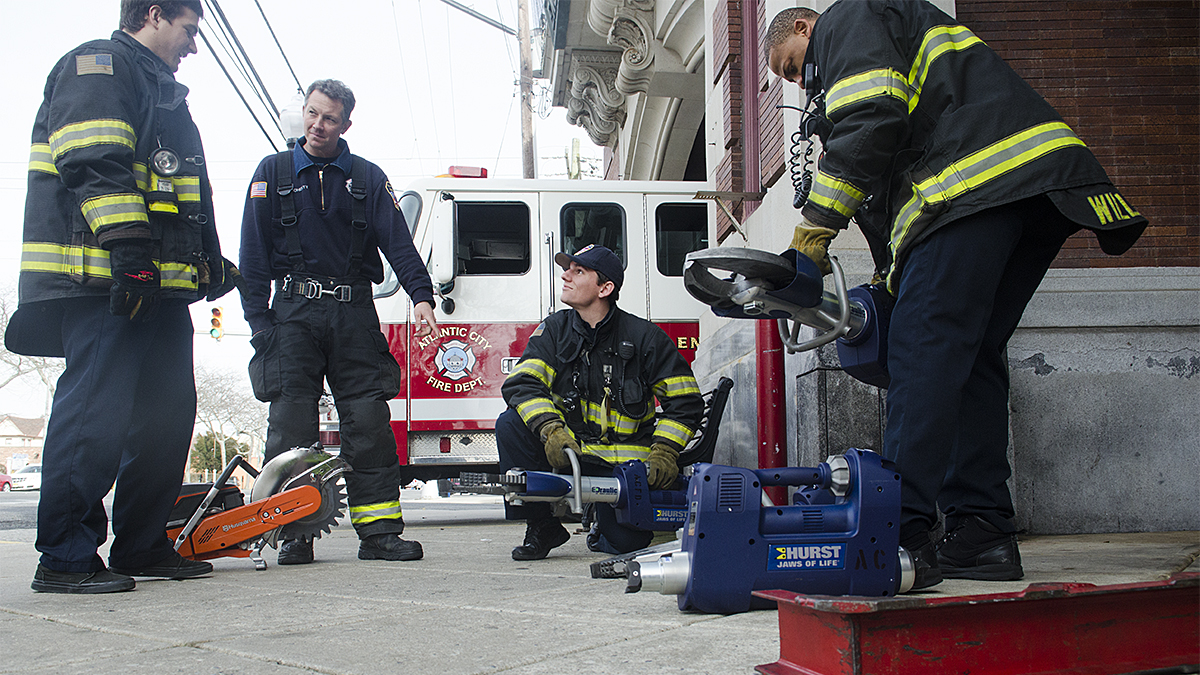  Atlantic City firefighters from Station 4,  Engine 4, Ladder 2, California Ave. prepare for duty. (Anthony Smedile for NewsWorks) 