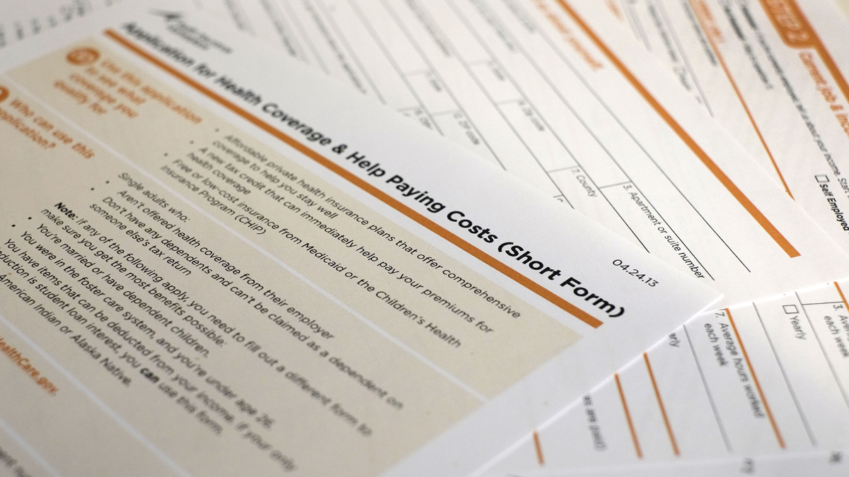 This file photo shows the short form for the federal Affordable Care Act application. (AP Photo/J. David Ake) 