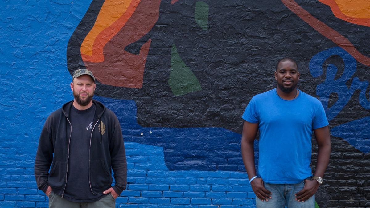  Current Brewerytown residents, Max Ochester (Left) and Andre Wright met at the 30th and Jefferson Street playground. Wright is the founder of Give and Go Athletics, a youth mentorship program in Brewerytown that uses sports to teach Philadelphia kids fundamental and life skills.Ochester is the owner of Brewerytown Beats, a used record store located on Girard Avenue. (Ifanyi Bell/for WHYY) 