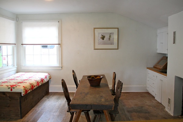 The Wyeth's sparely furnished kitchen is decorated with works borrowed from the nearby Brandywine Museum, in this case, Winter Bees. (Emma Lee/for NewsWorks)