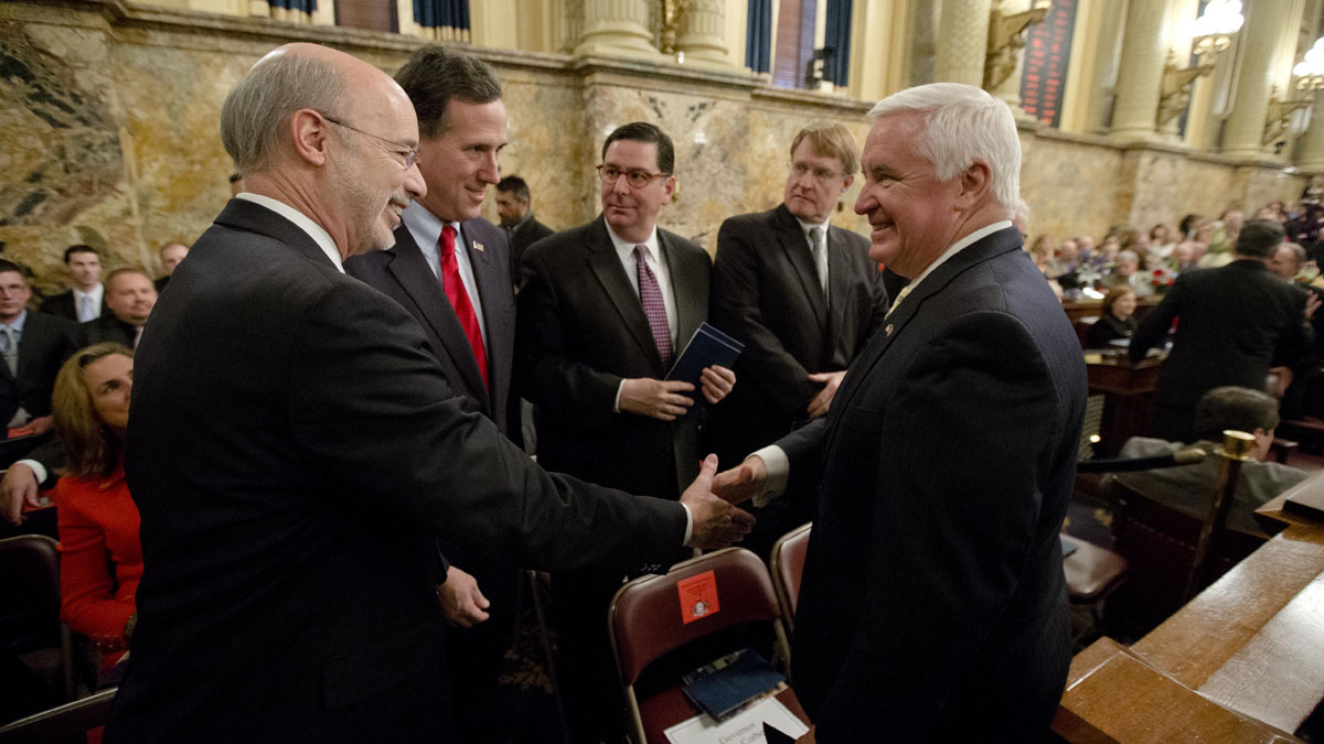  Democratic Gov.-elect Tom Wolf, left, shakes hands with Gov. Tom Corbett, right, as former U.S. Sen. Rick Santorum looks on Tuesday  before newly elected members of the Pennsylvania Legislature were sworn in. The Senate and House chambers both adjourned until Wolf's swearing in Jan. 20. (AP Photo/Matt Rourke 