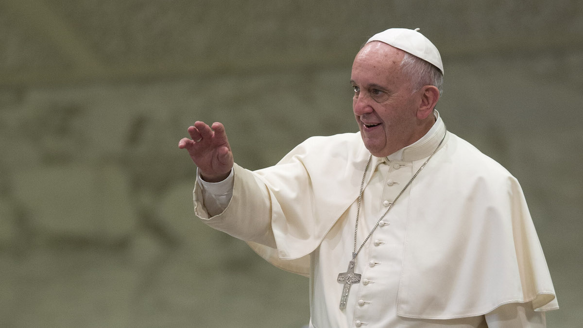  Pope Francis blesses the faithful as he arrives for his weekly general audience he held in the Pope Paul VI hall, at the Vatican, Wednesday, Aug. 12, 2015. (AP Photo/Andrew Medichini) 