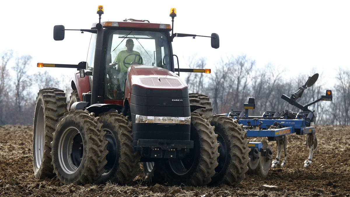  A farmer moves his tractor after turning over the soil in a field on a farm in Prospect, Pennsylvania. (AP Photo/Keith Srakocic) 