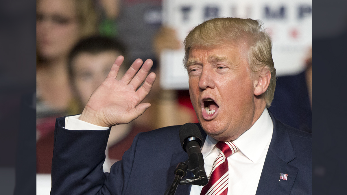 Republican presidential candidate Donald Trump waves to the crowd during a rally in Roanoke