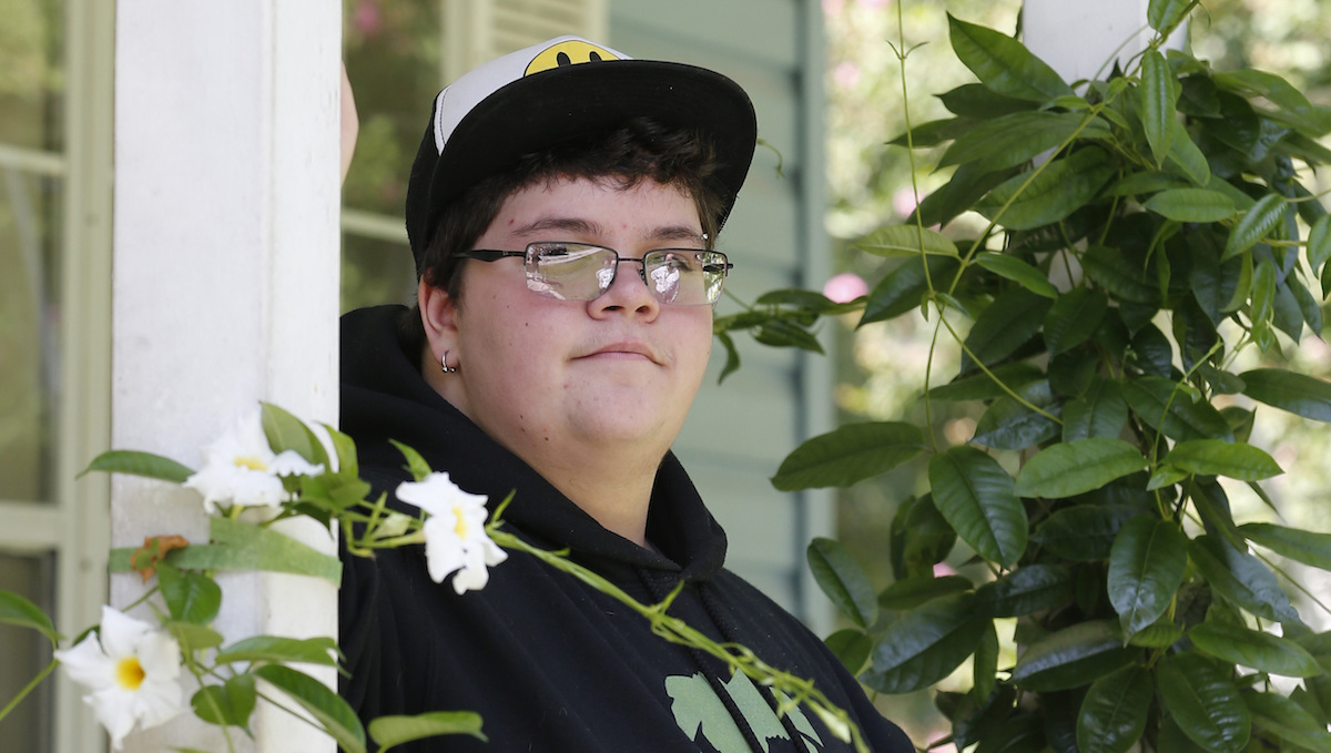   In this Aug. 25, 2015 file photo, Gavin Grimm poses on his front porch during an interview at his home in Gloucester, Va. (AP Photo/Steve Helber, File) 