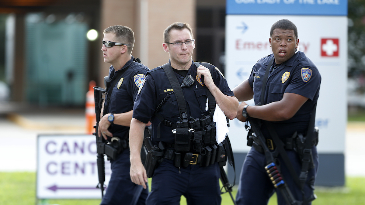 Police guard the emergency room entrance of Our Lady Of The Lake Medical Center