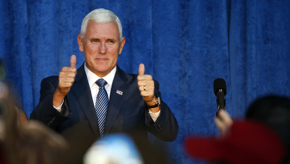 Republican vice presidential candidate Indiana Gov. Mike Pence arrives at a campaign rally