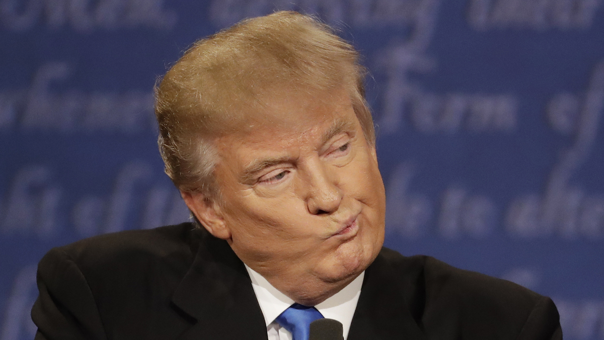 Republican presidential nominee Donald Trump listens to Democratic presidential nominee Hillary Clinton during the presidential debate at Hofstra University in Hempstead