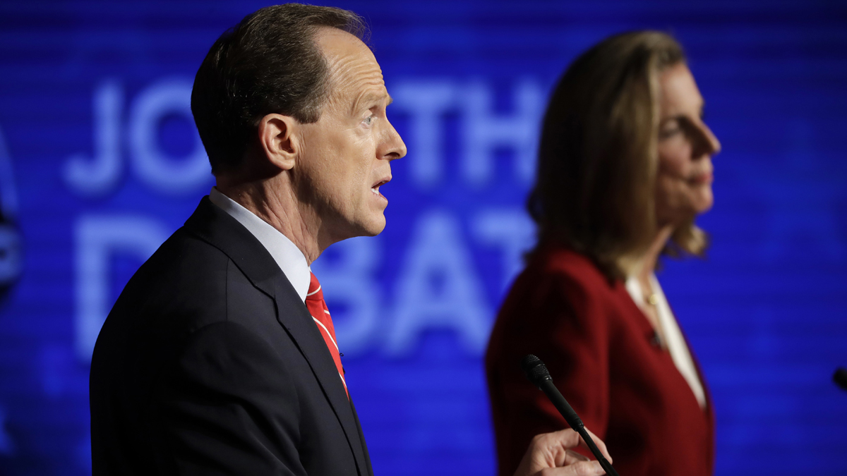 Pennsylvania U.S. Senate candidates Republican Sen. Pat Toomey (left) and Democrat Katie McGinty take part in a debate at Temple University in Philadelphia Monday night. (AP Photo/Matt Rourke)