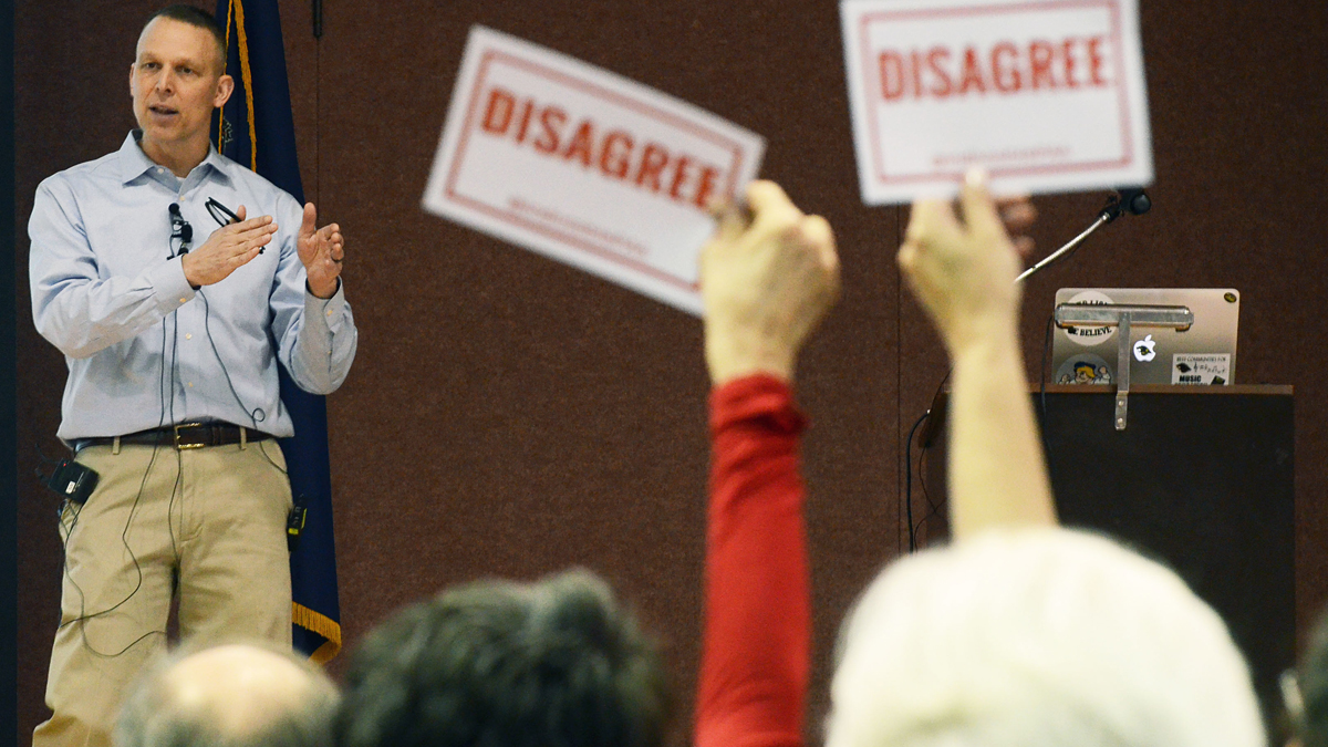  At a March 18 town hall, constituents disagree with a statement by Pennsylvania U.S. Rep. Scott Perry. A crowd unhappy with his support of the American Health Care Act showed up at his office a day after its approval.(AP Photo/Marc Levy) 