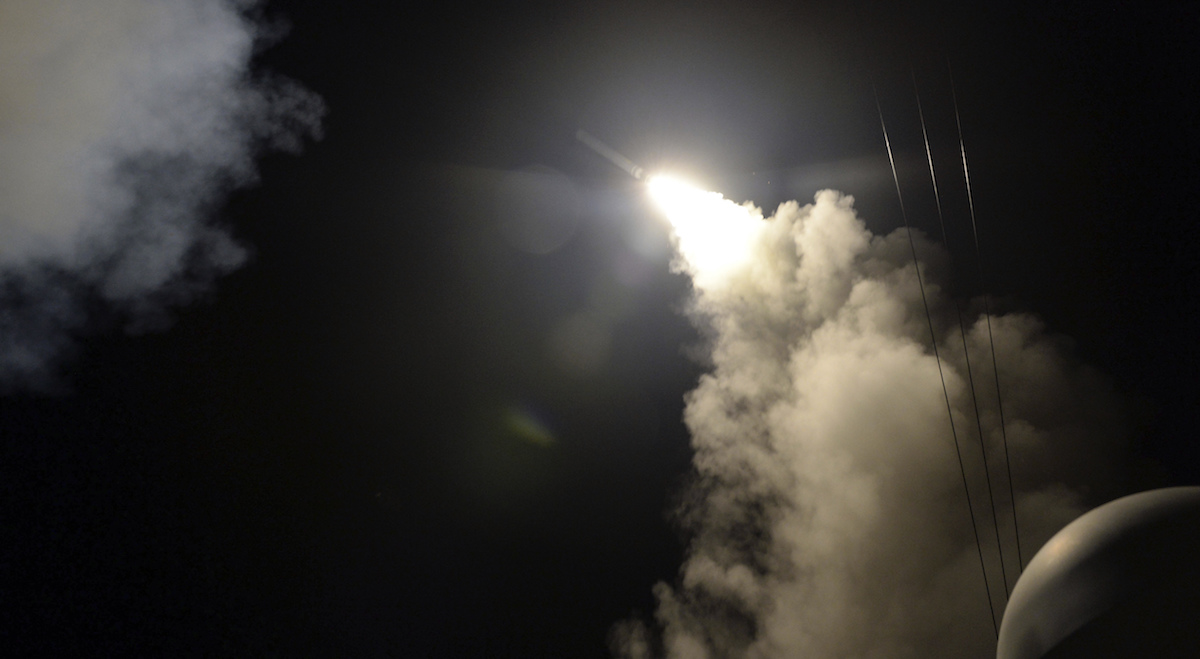 In this image provided by the U.S. Navy, the guided-missile destroyer USS Porter (DDG 78) launches a tomahawk land attack missile in the Mediterranean Sea, Friday, April 7, 2017. The United States blasted a Syrian air base with a barrage of cruise missiles in fiery retaliation for this week's gruesome chemical weapons attack against civilians. (Mass Communication Specialist 3rd Class Ford Williams/U.S. Navy via AP) 