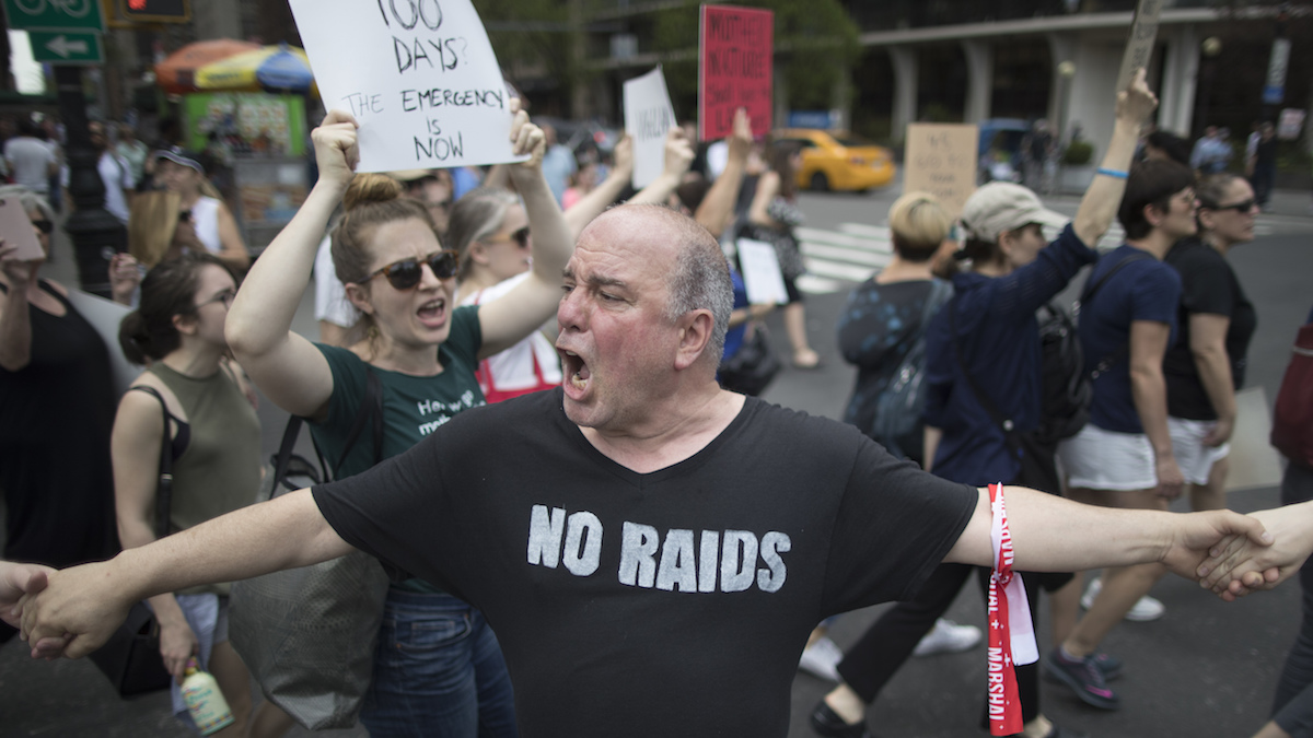  Demonstrators march across Central Park South during 
