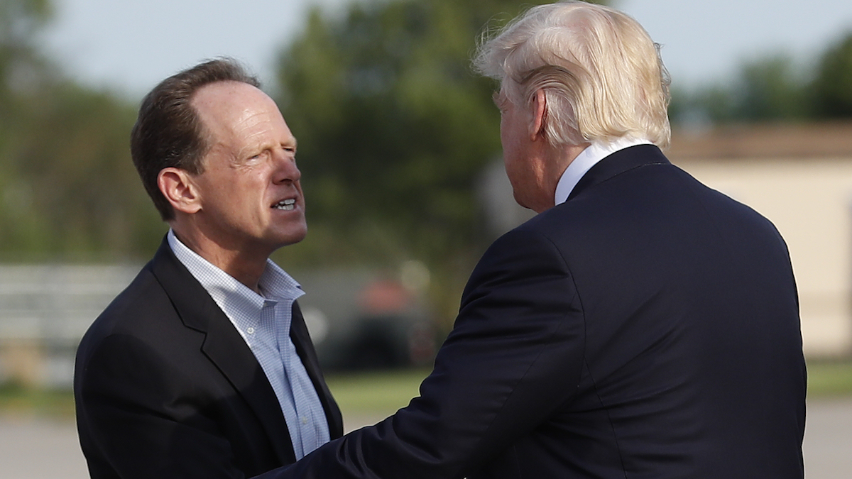  Sen. Pat Toomey, R-Pa., greets President Donald Trump as he arrives on Air Force One at Harrisburg International Airport in Middletown, Pennsylvania. (AP Photo/Carolyn Kaster) 