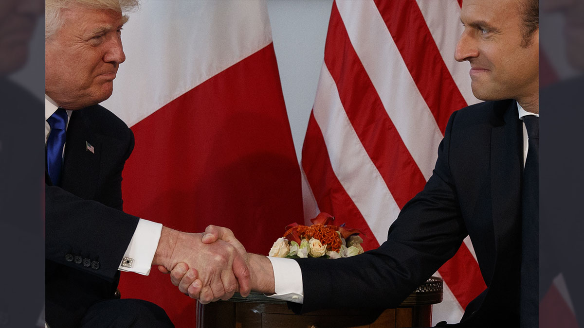  FILE - In this May 25, 2017 file photo, President Donald Trump shakes hands with French President Emmanuel Macron during a meeting at the U.S. Embassy in Brussels. Trump hasn’t done a lot of public speaking during his big trip abroad. But the president’s body language and that of those around him has spoken volumes. (AP Photo/Evan Vucci, File) 
