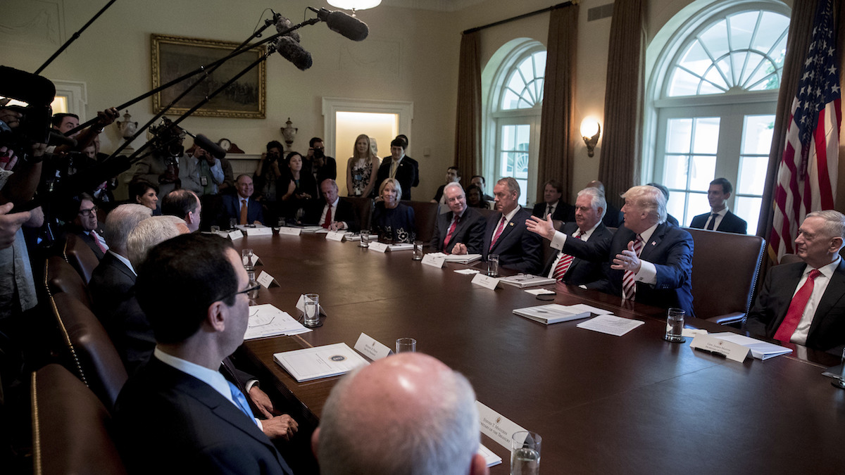  President Donald Trump, flanked by Secretary of State Rex Tillerson, left, and Defense Secretary Jim Mattis, speaks during a Cabinet meeting, Monday, June 12, 2017, in the Cabinet Room of the White House in Washington. (AP Photo/Andrew Harnik) 