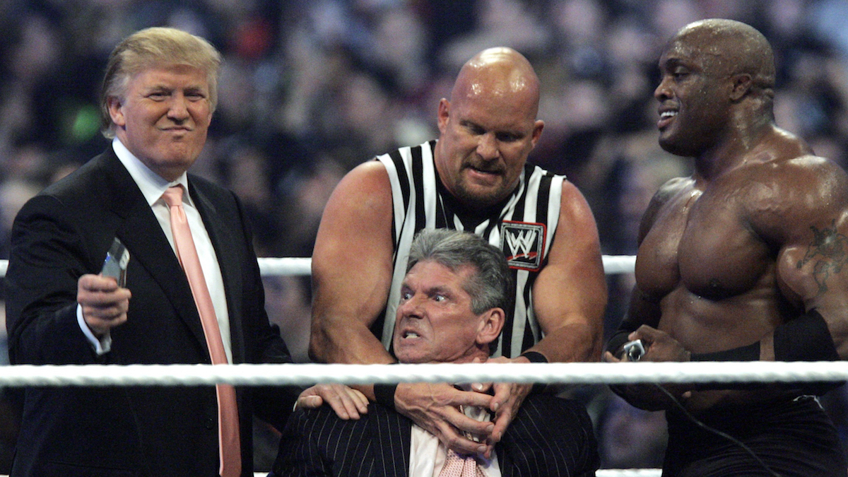  In this Sunday, April 1, 2007, file photo, WWE Chairman Vince McMahon, center, held by 