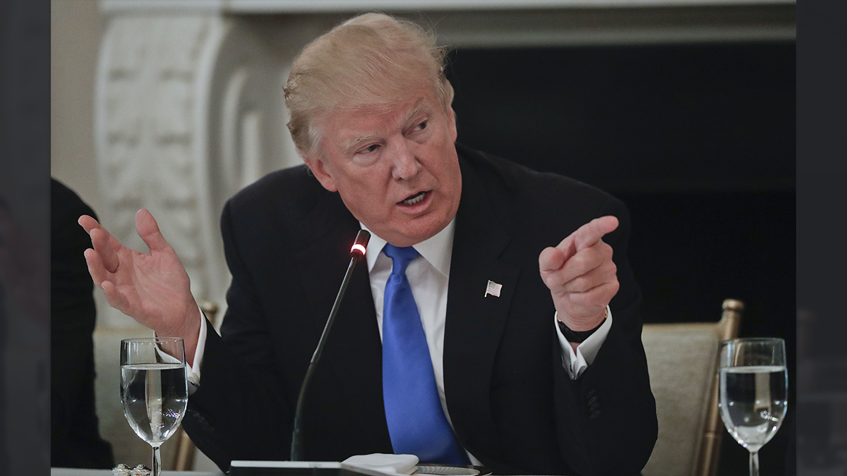 President Donald Trump points towards GOP Senators during their luncheon, Wednesday, July 19, 2017, in the State Dinning Room of the White House in Washington. (AP Photo/Pablo Martinez Monsivais) 