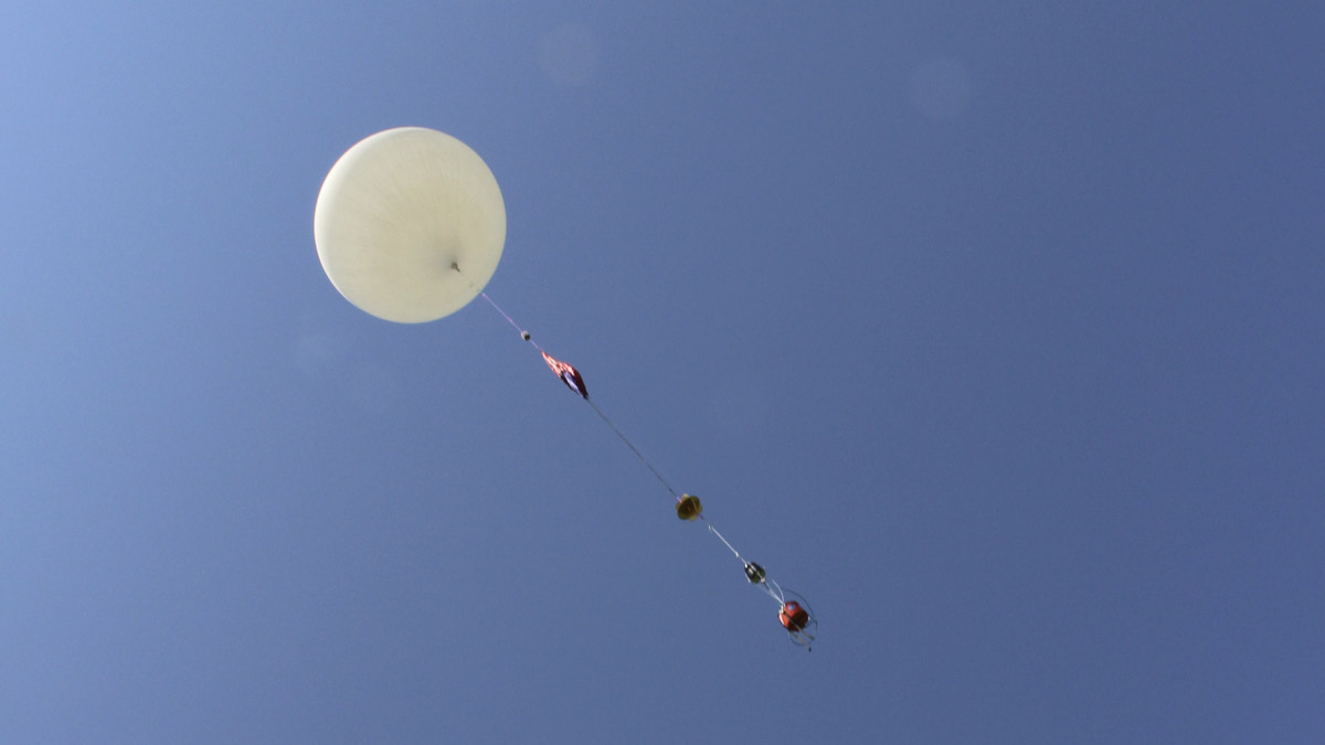  An 8-foot camera-carrying balloon has a test launch before Monday's solar eclipse. (AP Photo/Pat Eaton-Robb) 