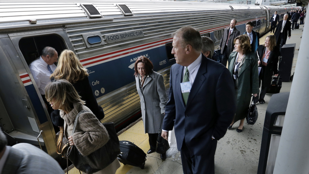  People head to assigned cars to board the annual New Jersey Chamber of Commerce’s 'Walk to Washington' train at the Trenton train station Thursday, Feb. 25, 2016, in Trenton, N.J. The Amtrak train gets its name from the idea that state lawmakers, lobbyists and business leaders walk up and down the train isles, networking, all the way from Newark to the nation's capital in a train chartered by the New Jersey Chamber of Commerce. (AP Photo/Mel Evans) 