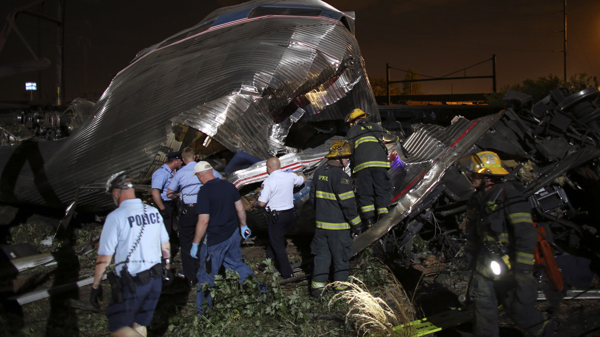  Emergency personnel work the scene of a train wreck May 12 in Philadelphia after an Amtrak train headed to New York City derailed and crashed. (AP Photo/Joseph Kaczmarek) 