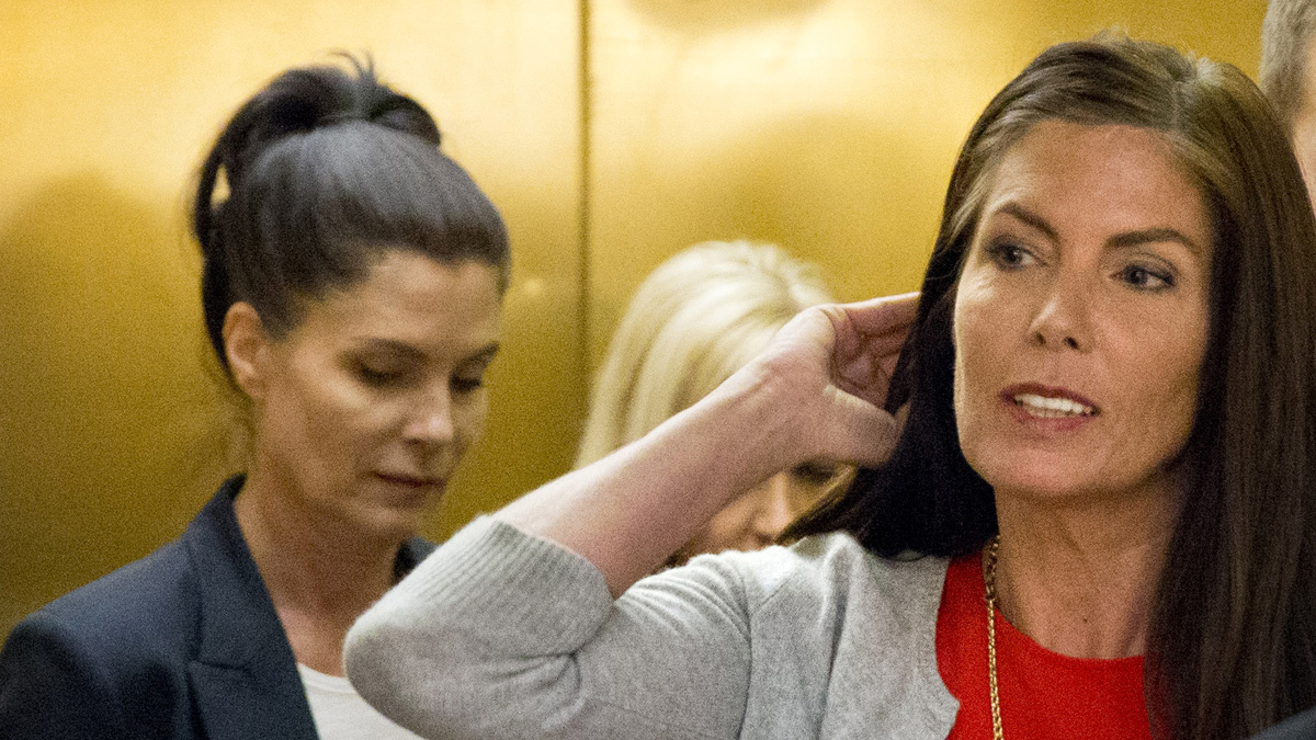  Pennsylvania Attorney General Kathleen Kane, right, says  ethics laws prohibit her involvement in any disciplinary action taken by her office with respect to her twin sister, attorney Ellen Granahan,left. (AP file photo)  
