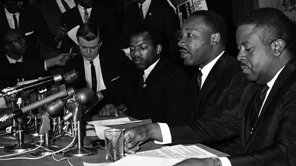  FILE - In this April 2, 1965 file photo, Dr. Martin Luther King Jr., second from right, speaks at a news conference next to John Lewis, to his left, chairman of the Student Nonviolent Coordinating Committee, in Baltimore. (AP Photo/William A. Smith, File) 