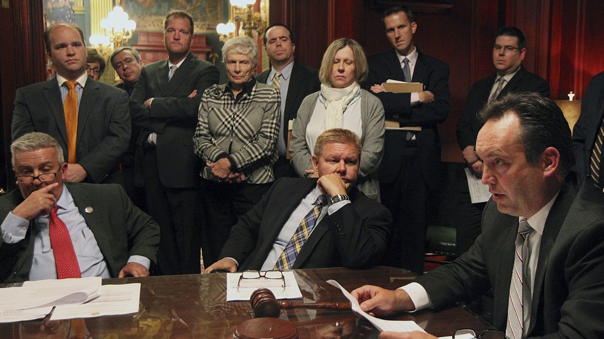  Pennsylvania Senate Majority Leader Jake Corman, R-Centre, right, flanked by his Republican colleagues, goes over pension legislation last week. Gov. Tom Wolf has until Friday night to act on that bill before it becomes law.(AP Photo/Chris Knight) 