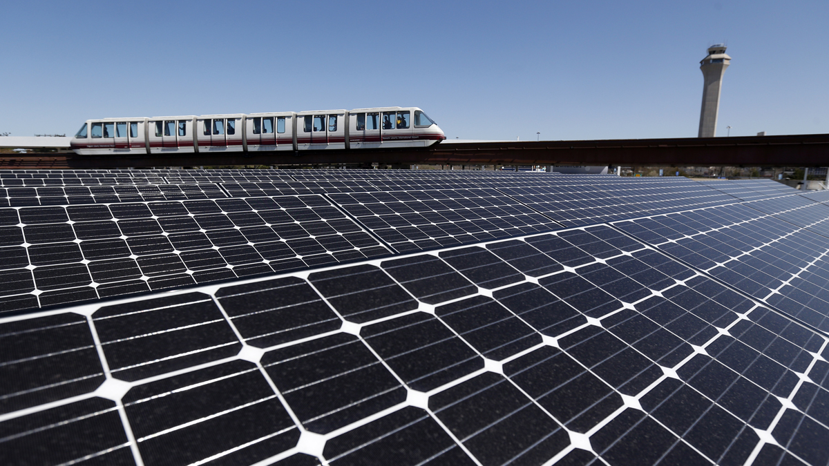 Solar panels on the roof of the building supplying energy to the AirTrain at Newark Liberty International Airport soak up the rays. A New Jersey lawmaker wants the state to aim for 80 percent renewable energy use by 2050. (AP file photo)
