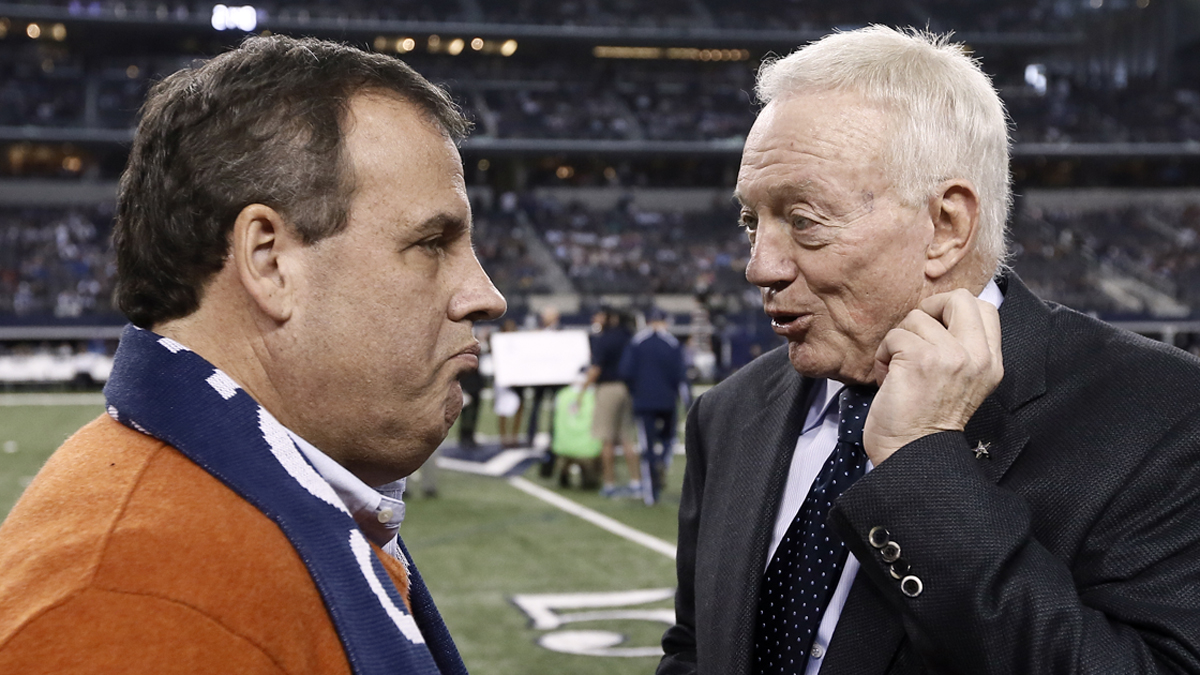  New Jersey Gov. Chris Christie, (left), talks with Dallas Cowboys team owner Jerry Jones, on the field as the teams warm up before an NFL football game against the Indianapolis Colts, Sunday, Dec. 21, 2014, in Arlington, Texas. (Brandon Wade/AP Photo) 