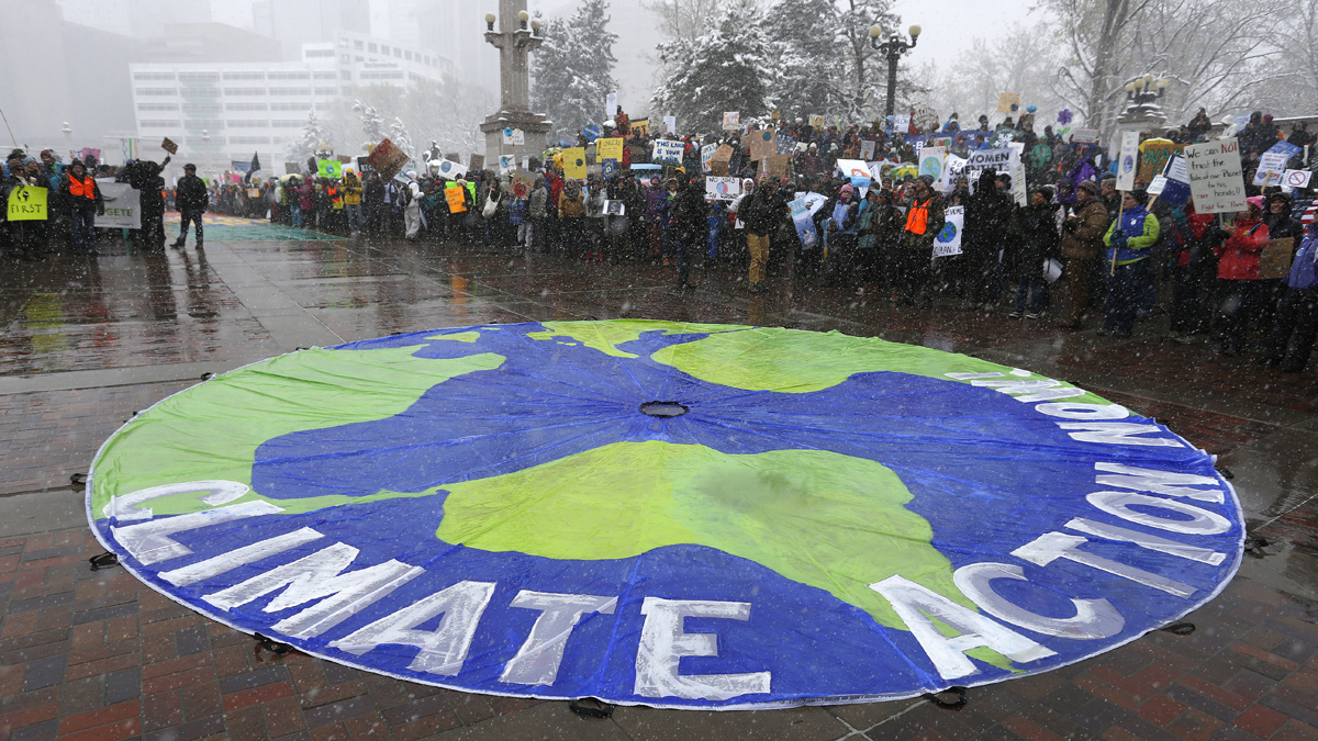  Participants chant during a climate change awareness rally, in Denver, Saturday, April 29, 2017. The gathering was among many others of its kind held nationwide marking President Donald Trump's 100th day in office. (Brennan Linsley/AP Photo) 