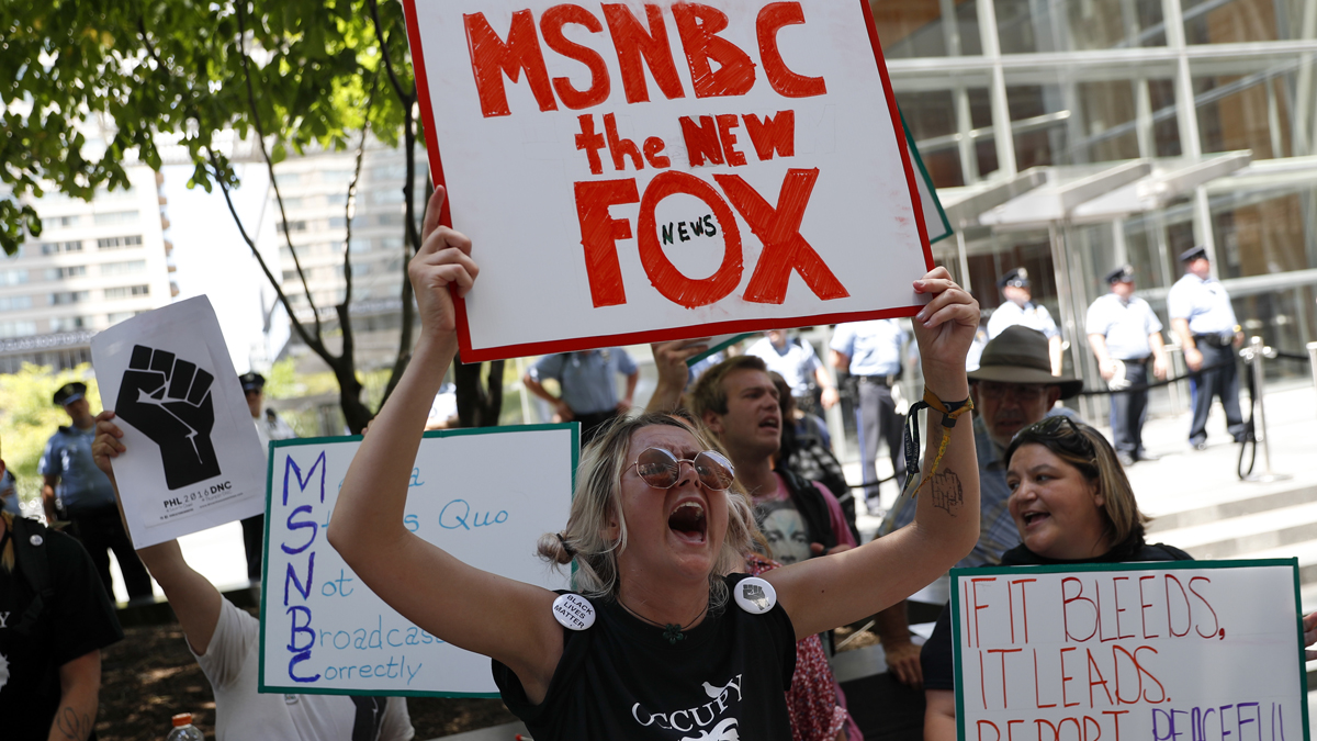 Demonstrators protest outside the Comcast Center in Philadelphia