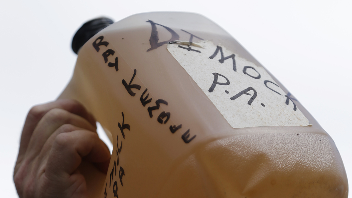  Ray Kemble of Dimock, Pa., holding a jug of his well water protests hydraulic fracturing outside a Marcellus Shale industry conference, Thursday, Sept. 20, 2012, in Philadelphia. (Matt Rourke/AP Photo) 