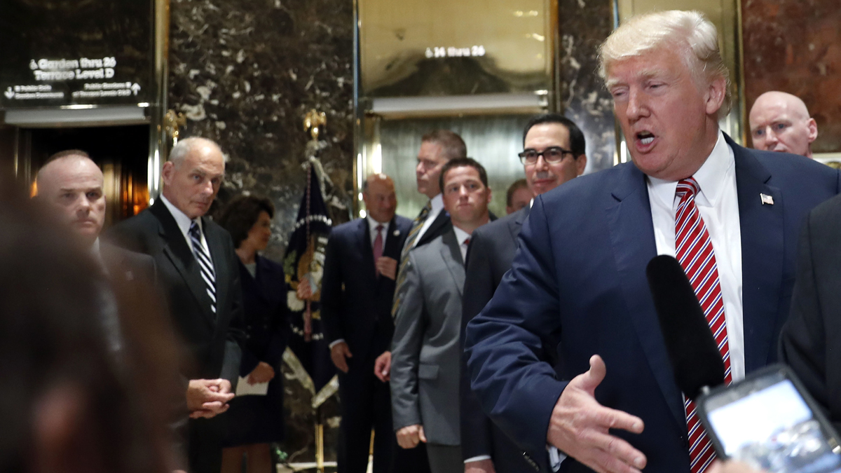  White House chief of staff John Kelly, (left), watches as President Donald Trump speaks to the media in the lobby of Trump Tower, Tuesday, Aug. 15, 2017 in New York. (Pablo Martinez Monsivais/AP Photo) 