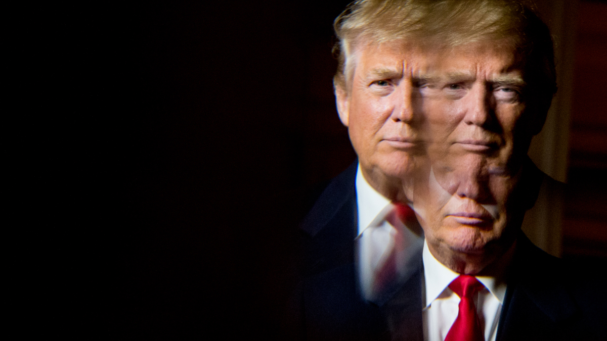  Republican presidential candidate Donald Trump, seen in reflection, poses for a portrait following an interview with the Associated Press at the Trump National Golf Club in Sterling, Virginia, this month. (Andrew Harnik/AP Photo)  
