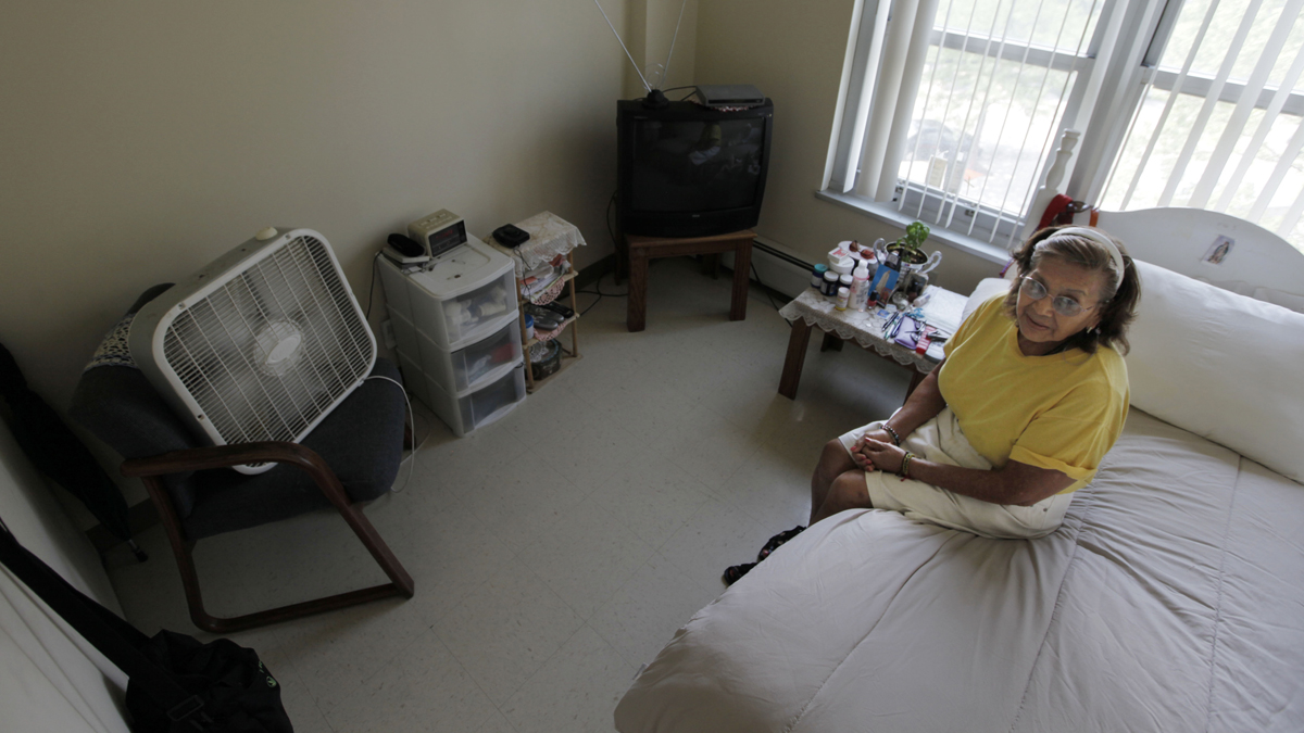  Tenant Virgina Mendoza stays cool with her fan and air conditioner, at her home in Apartamentos Las Americas during a well-being check by the Chicago Housing Authority Friday, July 6, 2012, in Chicago. (M. Spencer Green/AP Photo, file) 