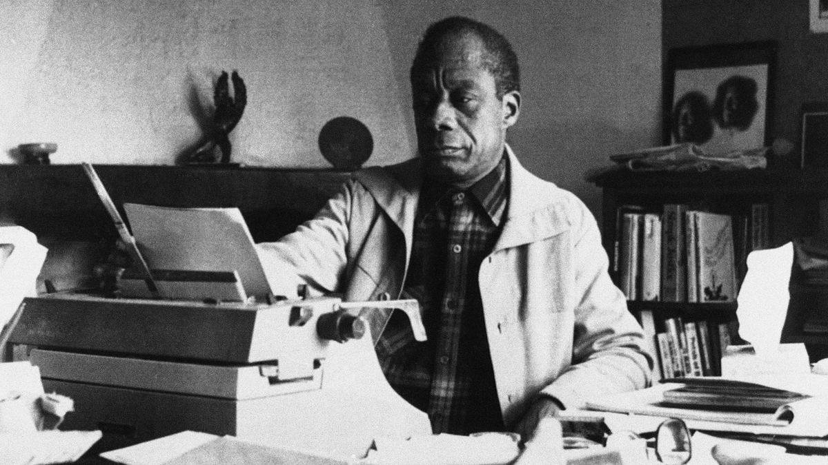 American writer James Baldwin poses in front of his typewriter in his house, March 15, 1983, Saint Paul de Vence, France. (Photo Pressenia/AP Photo)