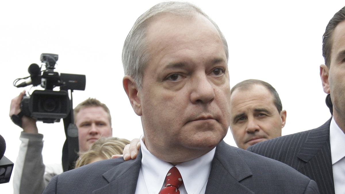  In this Nov. 13, 2009 file photo, former Pennsylvania House Speaker John Perzel, R-Philadelphia, walks through members of the media after attending a hearing in Harrisburg, Pa. (Carolyn Kaster/AP Photo, File) 